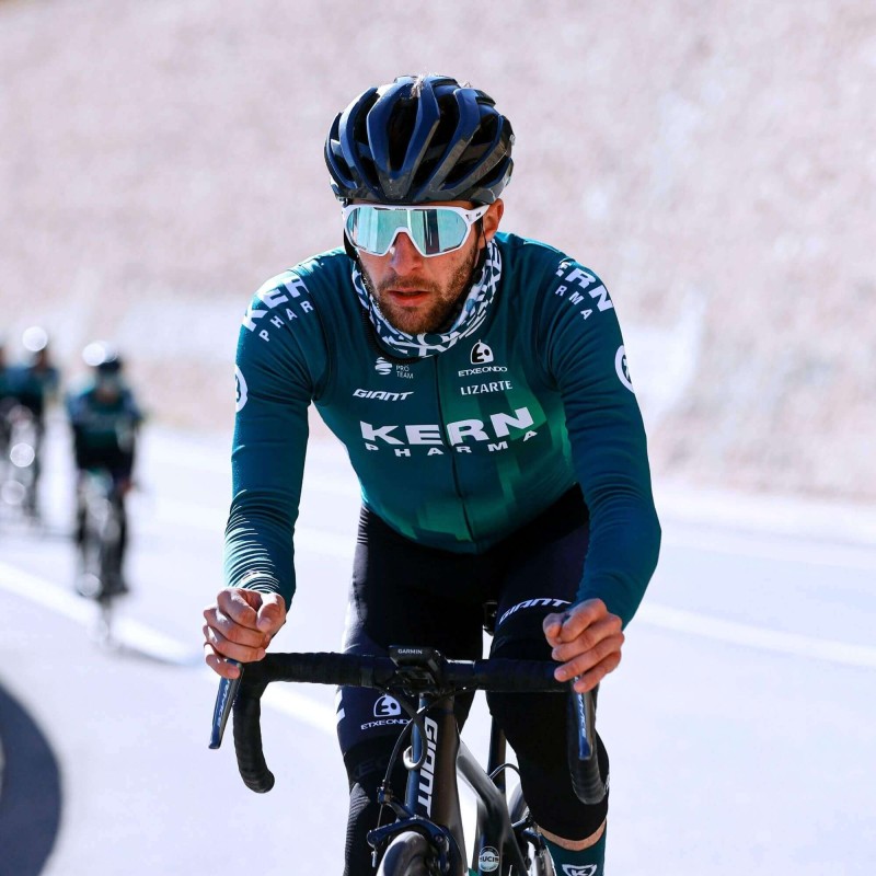 Kern Pharma Team Cyclist with Paradiso EASSUN Cycling Sunglasses with REVO Blue Lens and Matte White Frame